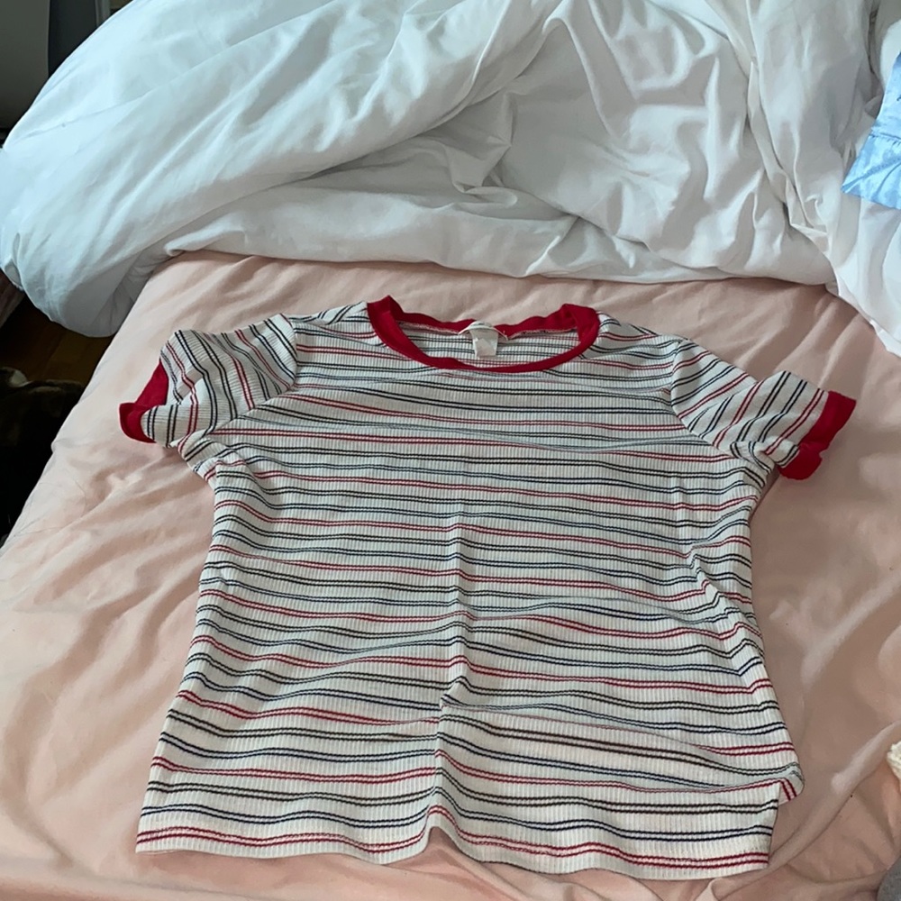 Red, black, and white striped shirt sleeve shirt.